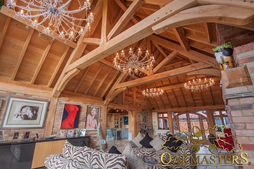 Raised collar truss and exposed vaulted ceiling complimented by chandelier lighting in sitting room of single storey home