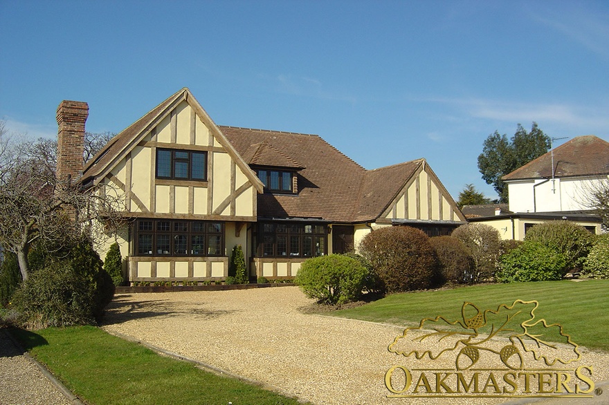 Exterior of tudor style country residence with exposed oak cladding