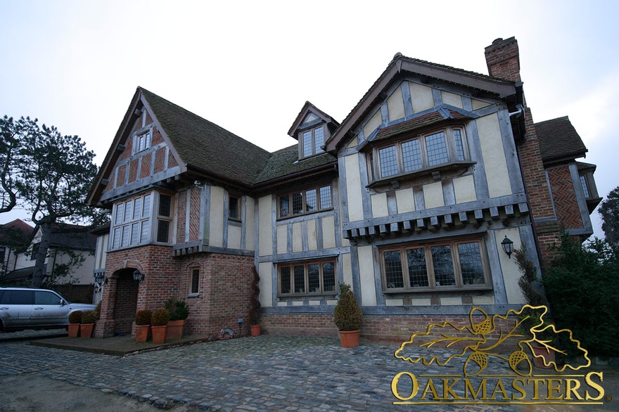 Exterior of newbuild with tudor style oak cladding