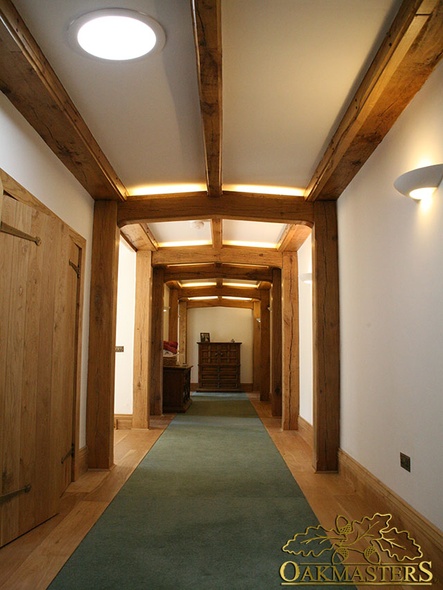 Modern exposed beams in unusual country house hallway