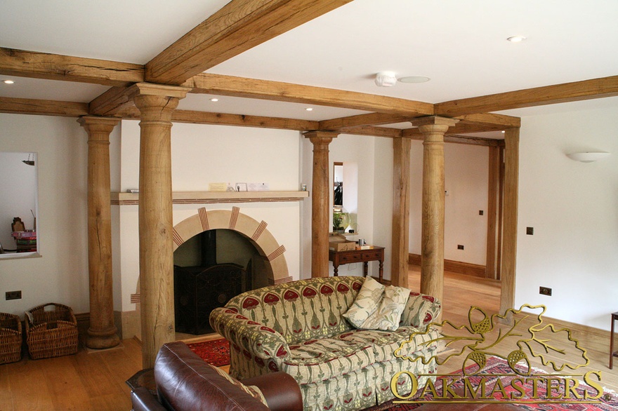 Bespoke oak columns meet ceiling beams in sitting room