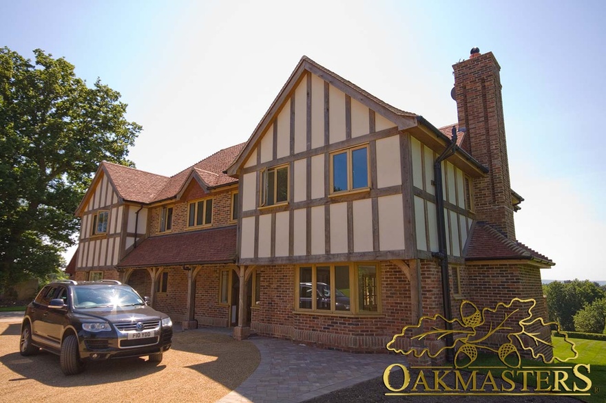 This hybrid house is build using a combination of masonry, solid oak frame and external oak cladding