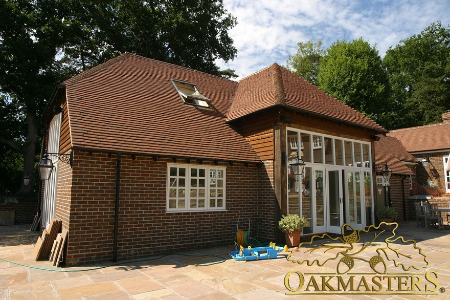 Outside view of brick and oak pool house