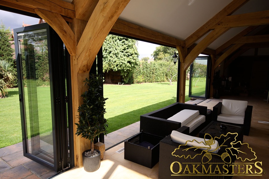 Detail of glazed oak framed pool house wall