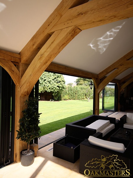 Oak brace and garden view from glazed pool house