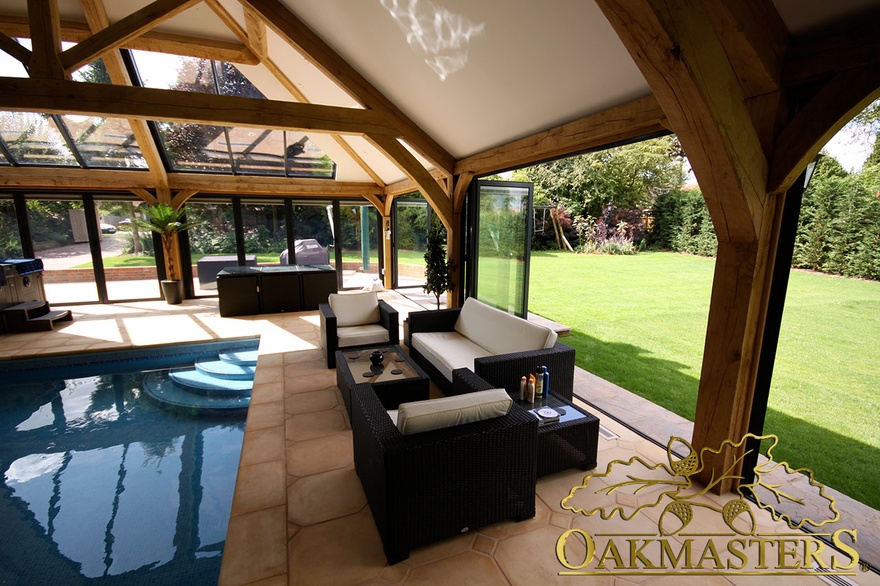 Oak framed pool building with aluminium bifold doors