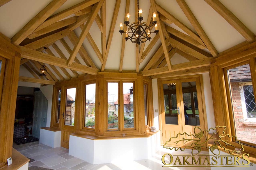 Complex oak roof design of an octagonal garden room