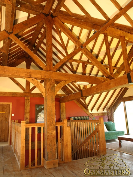 Complex roof design with exposed trusses and oak rafters
