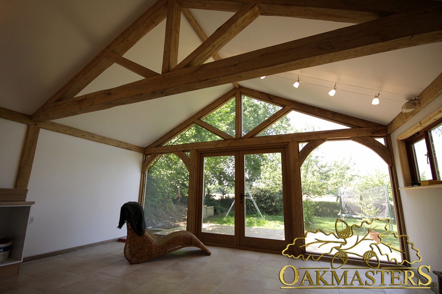 Exposed truss in open ceiling in garden room extension