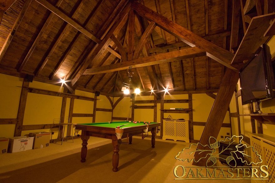 Barn style games room with exposed raised tie truss