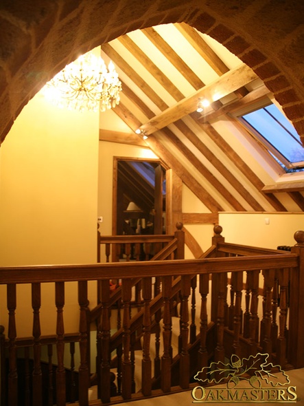 Beautiful landing with exposed oak rafters and a crystal chandelier