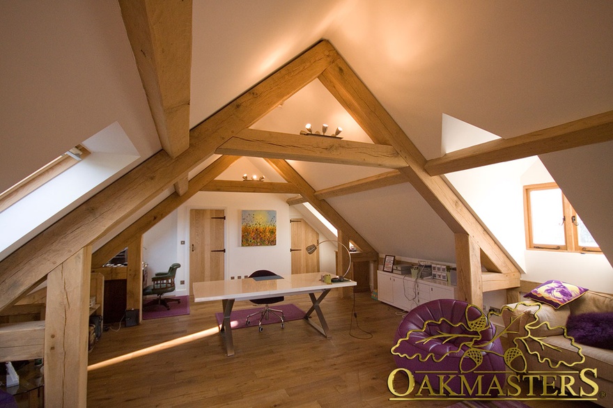 Exposed oak purlins and queen post trusses in a modern loft