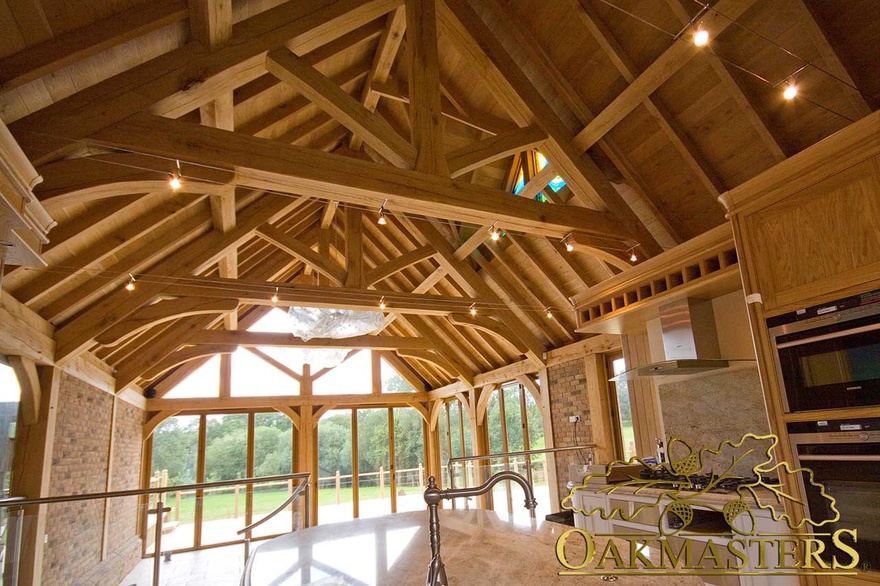 Raised oak tie trusses in family sun room