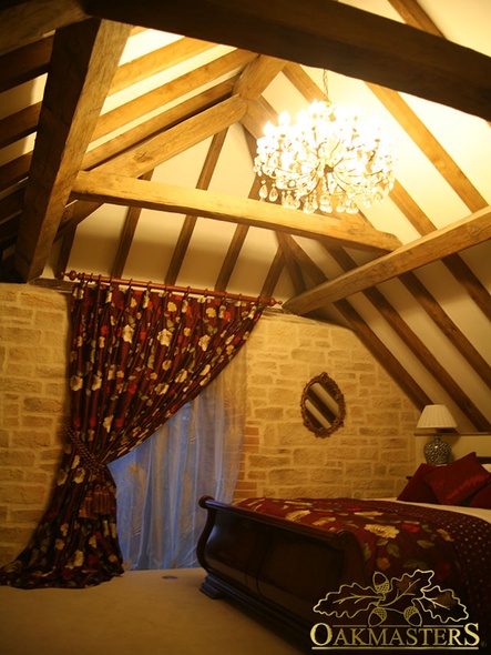 Detail of oak rafters meeting in the apex of the roof