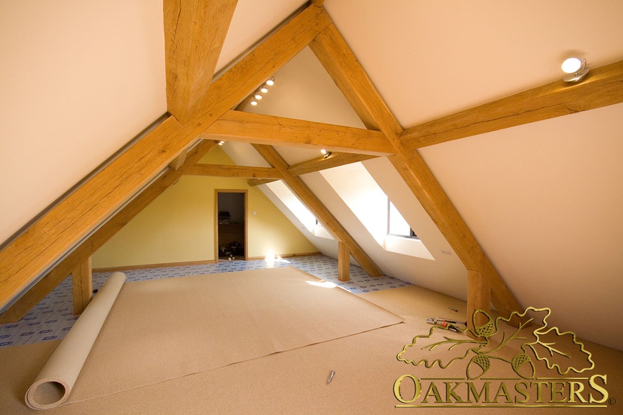 Garage loft space with raised tie trusses