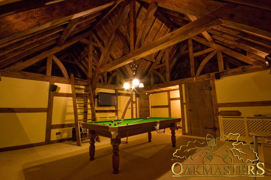 Raised tie truss created extra height in barn style games room