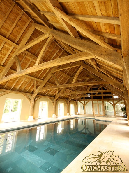 Vaulted swimming pool roof with raised queen tie truss