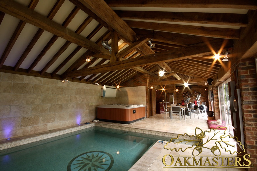 Vaulted roof with exposed rafters above swimming pool