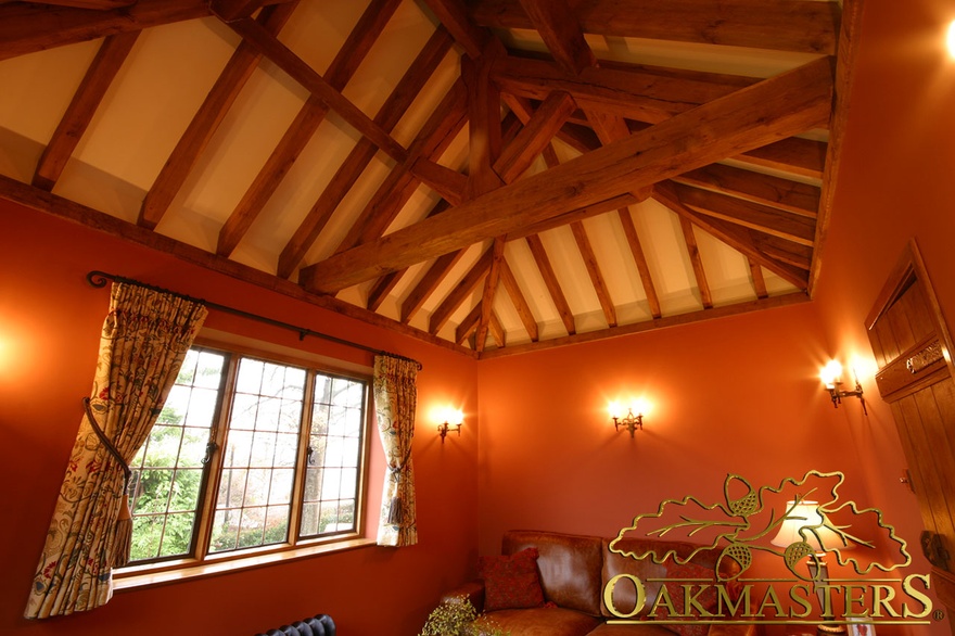 Exposed king-post truss and open ceiling in country sitting room