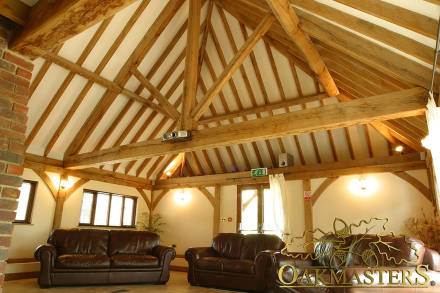 King post truss and exposed rafters on open ceiling in entertainment space
