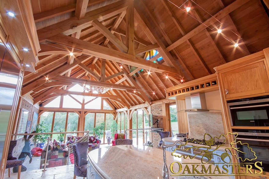 Traditonal exposed trusses with lighting in large family sun room