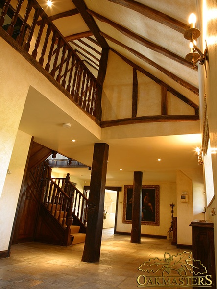 Vaulted ceiling in double height hallway with gallery balcony