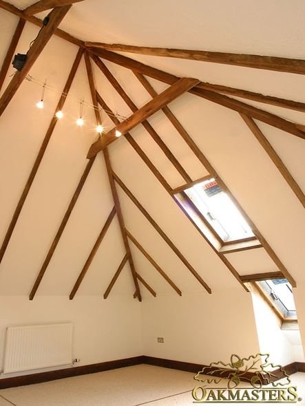 Beautiful detail of exposed rafters converging in the apex of the roof