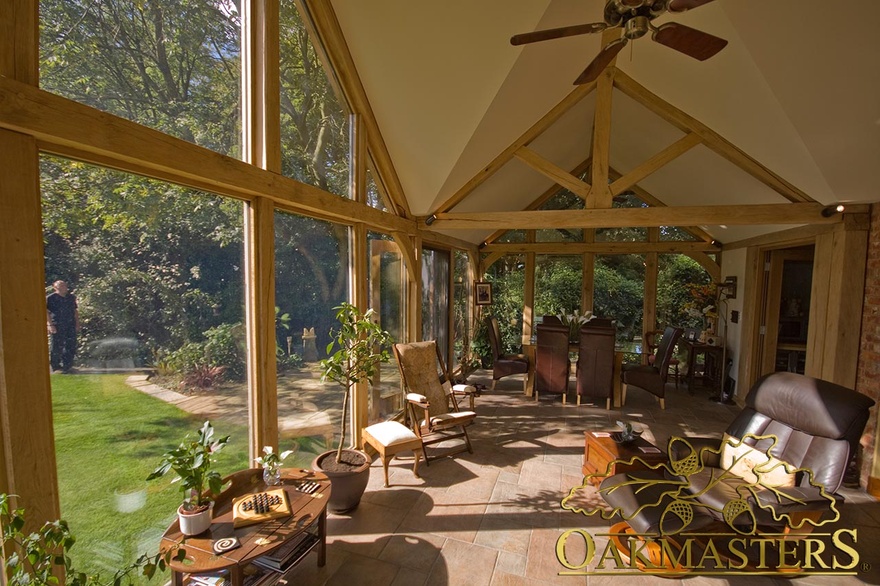 Views of garden in sunny garden room built to match cottage