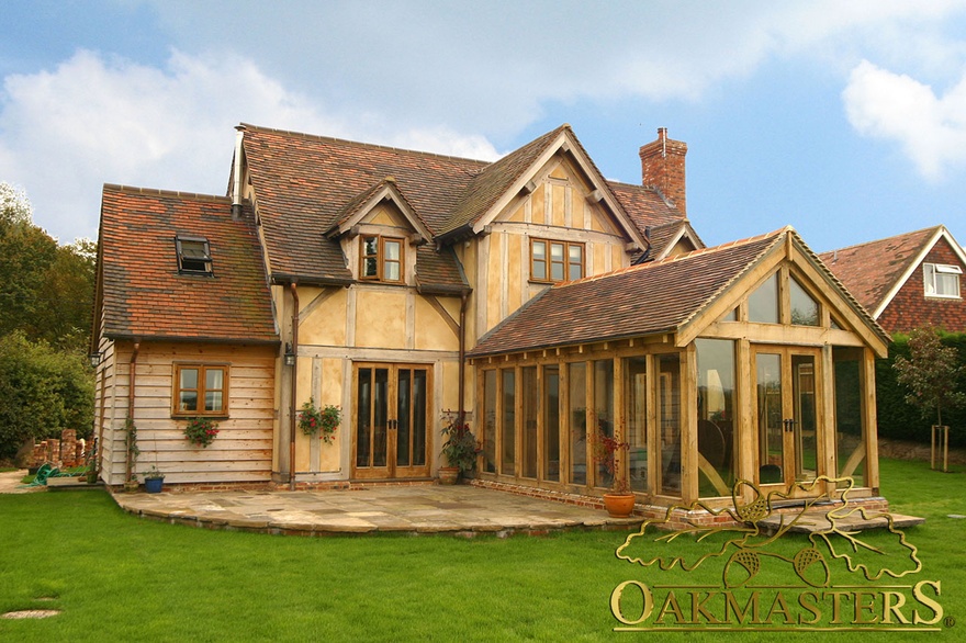 Oak garden room extension with full height glazing built to match existing house