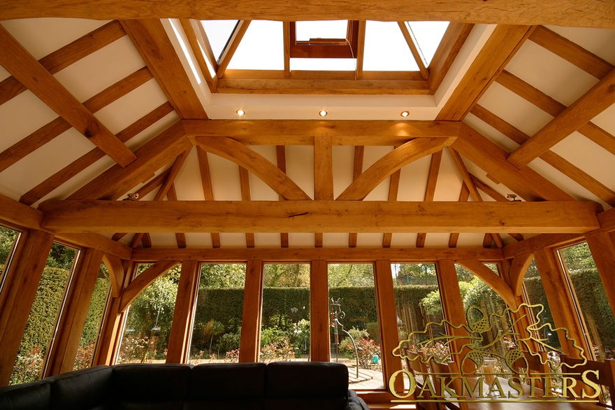 Spot lighting surrounding glazed lantern roof of listed manor house orangery