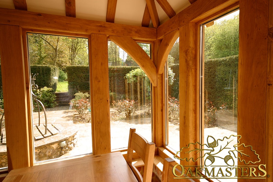 Curved oak brace corner detail inside manor house orangery