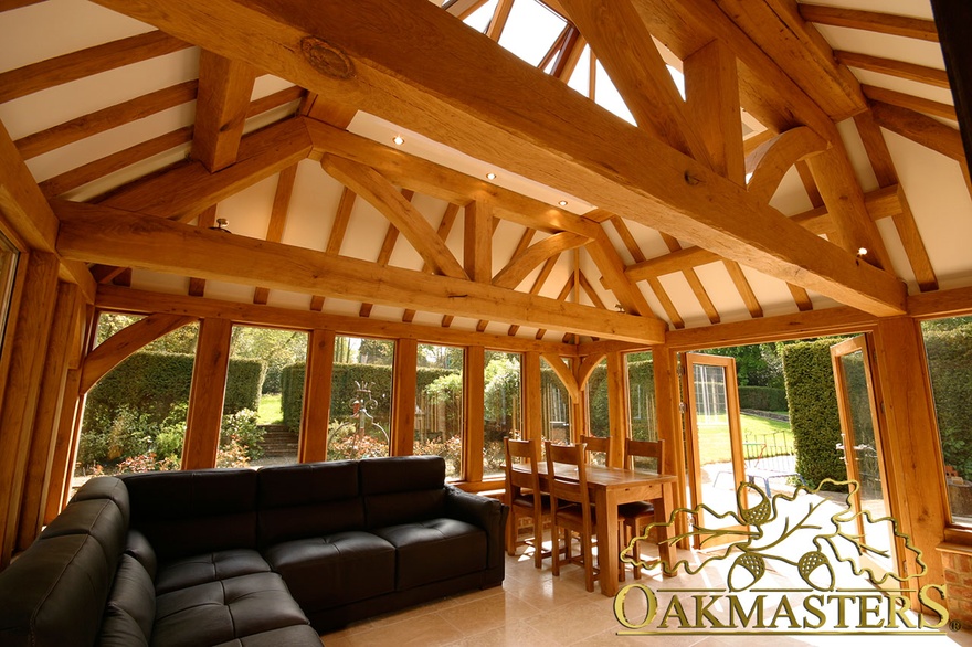 Exposed rafters and roof trusses on vaulted ceiling of manor house orangery