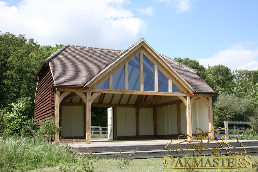 Exterior showing glazed gable and oak clad walls of amenity building