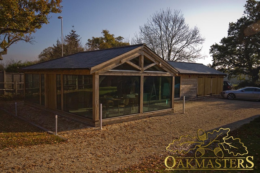 Glazed gable end of garden room office and garage with closed double bay