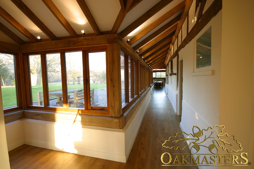 Corner interior of oak frame glazed verandah on listed house