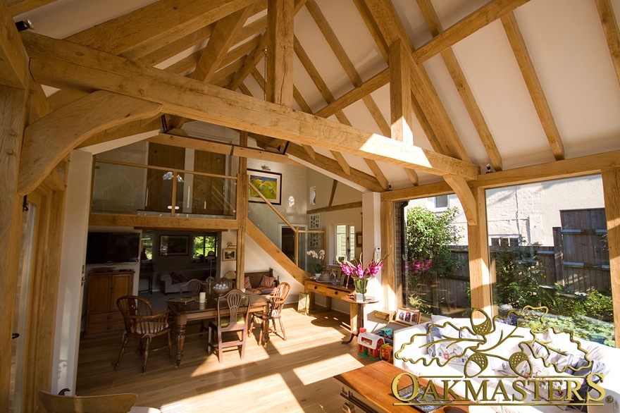 Dining area and gallery staircase in spectacular garden room