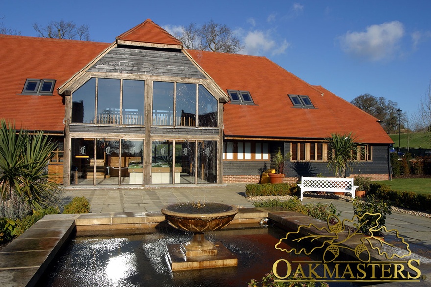 Large full height glazed oak framed gable is the main feature of this oak framed outbuilding