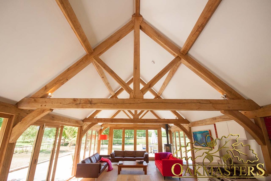 Detail of king post truss in a modern oak framed kitchen extension