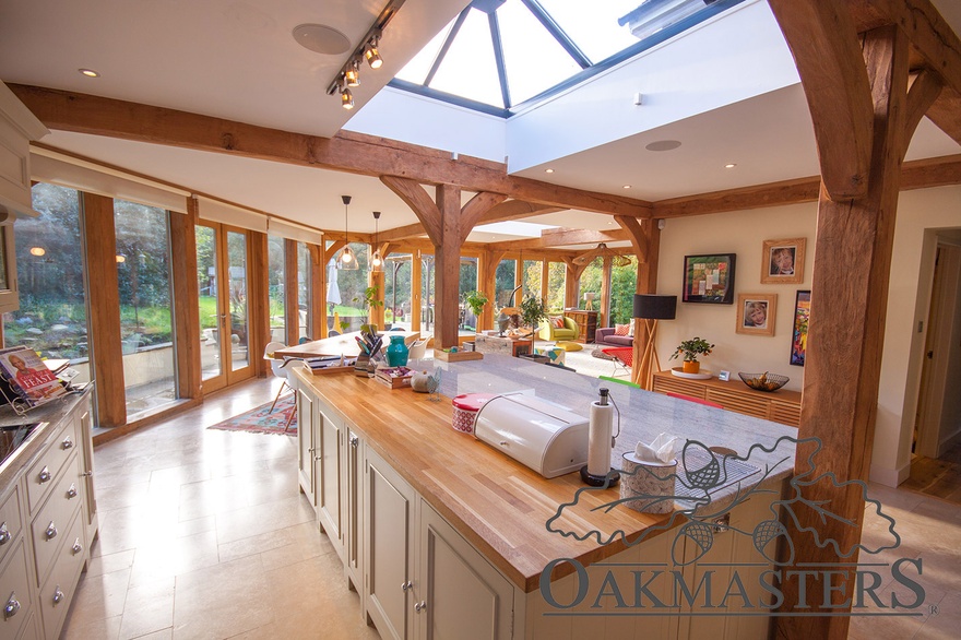 Roof lantern floods light onto the kitchen island in this oak extension