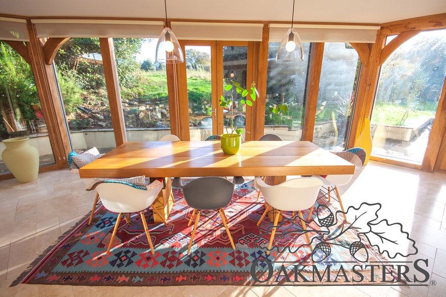 Light plays a game of shadows on this oak dining table