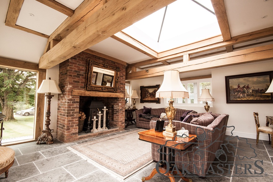 Traditional oak and brick fireplace with wood burning stove