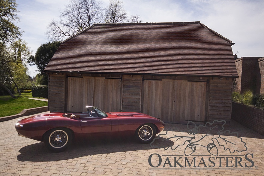 Hipped and tiled roof perfectly complements the oak framed garage