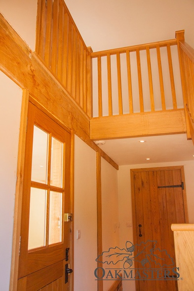 Handmade oak staircase and doors match the overall look