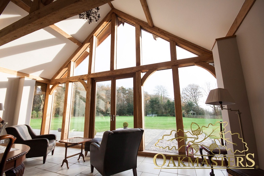 Looking out onto the garden through a full height oak framed glazed gable
