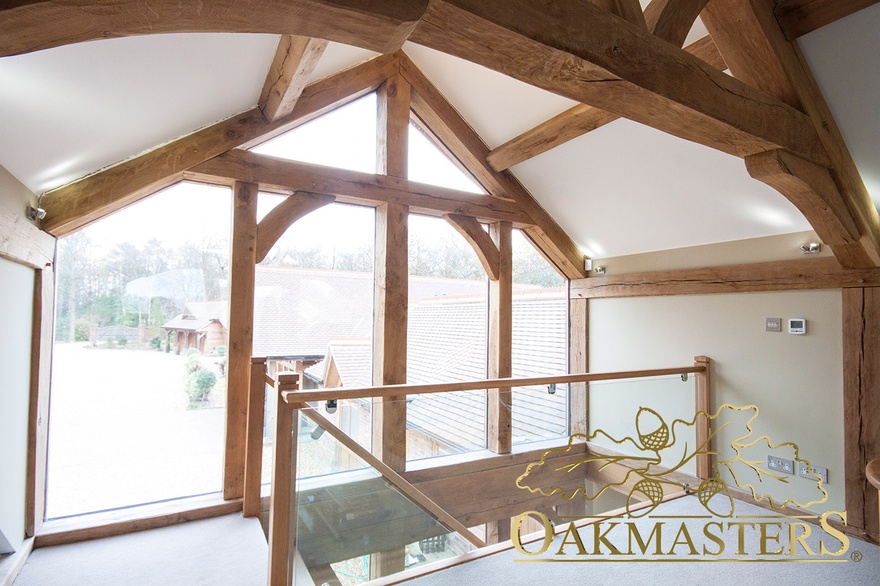 Glazed gable on top of the oak staircase looks out onto the front yard