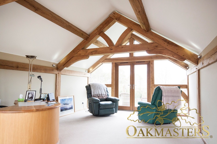 Upstairs office with raised tie trusses to create extra head room