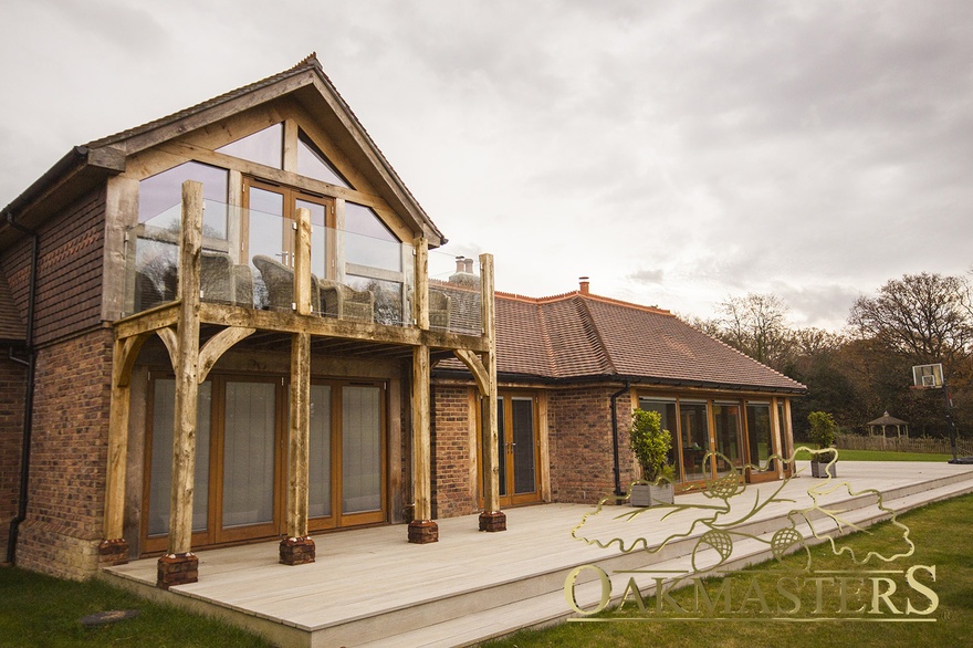 Oak balcony with glazed railing allow uninterrupted views