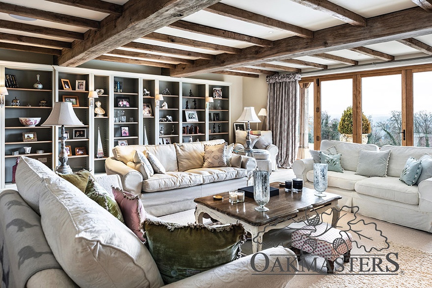 Sitting room features an oak beam layout