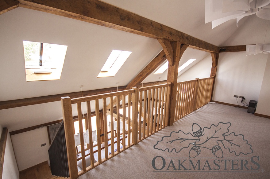 Oak posts and oak brackets frame part of this lovely long oak landing