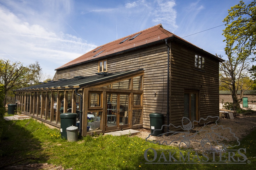 The back of the former oak barn now features a large oak framed greenhouse